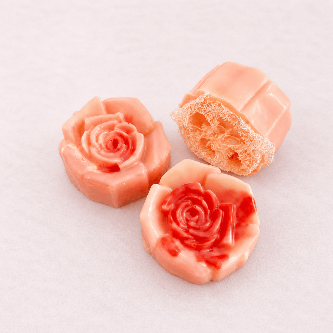 limited edition shea butter soap in elegant rose shapes, showcasing creamy moisturizing texture.