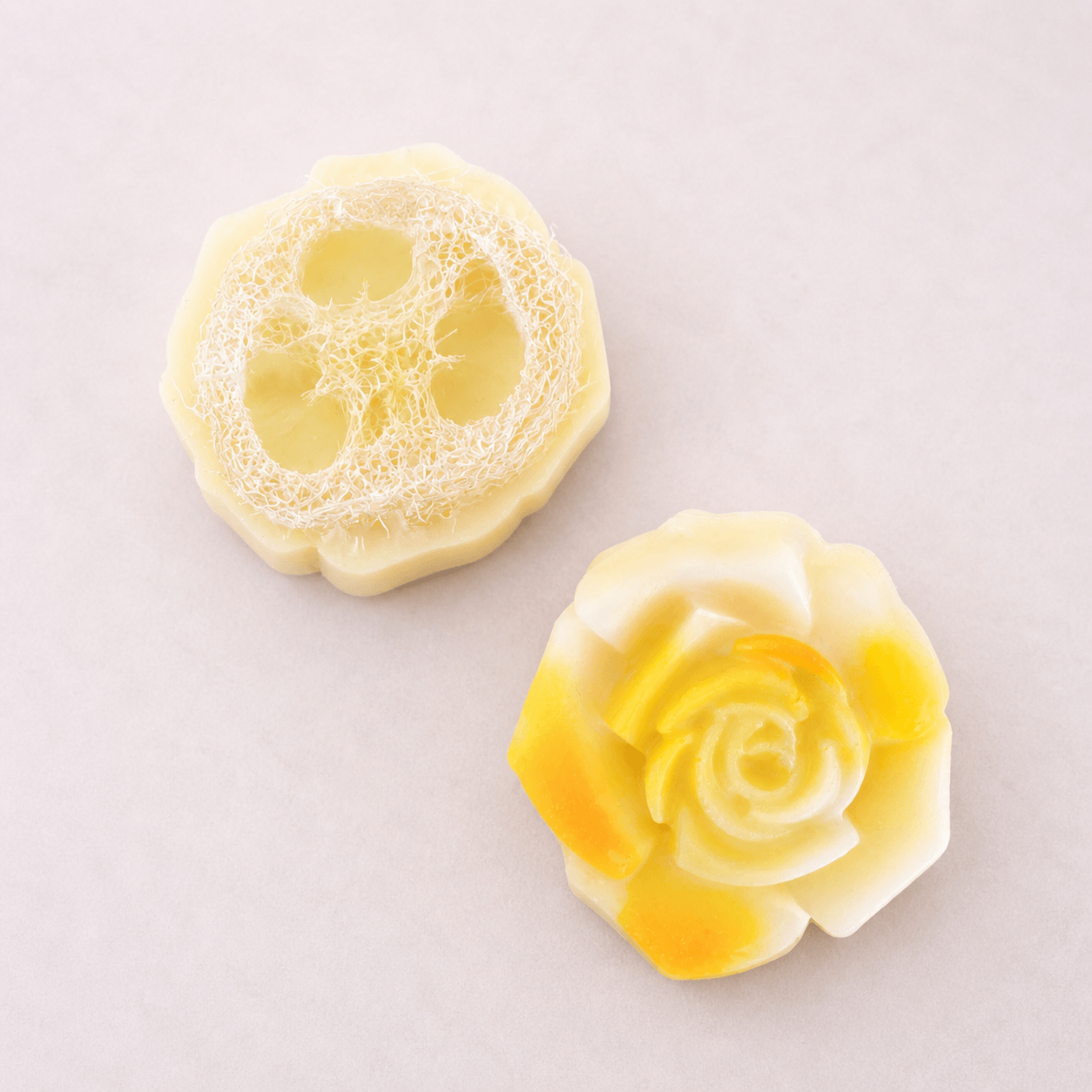 limited edition shea butter soap artisan soap with floral designs and loofah texture on a light background