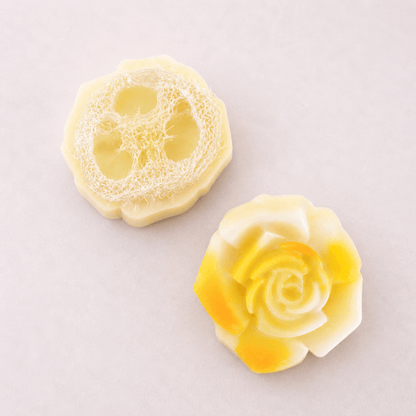 limited edition shea butter soap artisan soap with floral designs and loofah texture on a light background