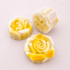 limited edition shea butter soap shaped like rose flowers, featuring creamy yellow and white colors.